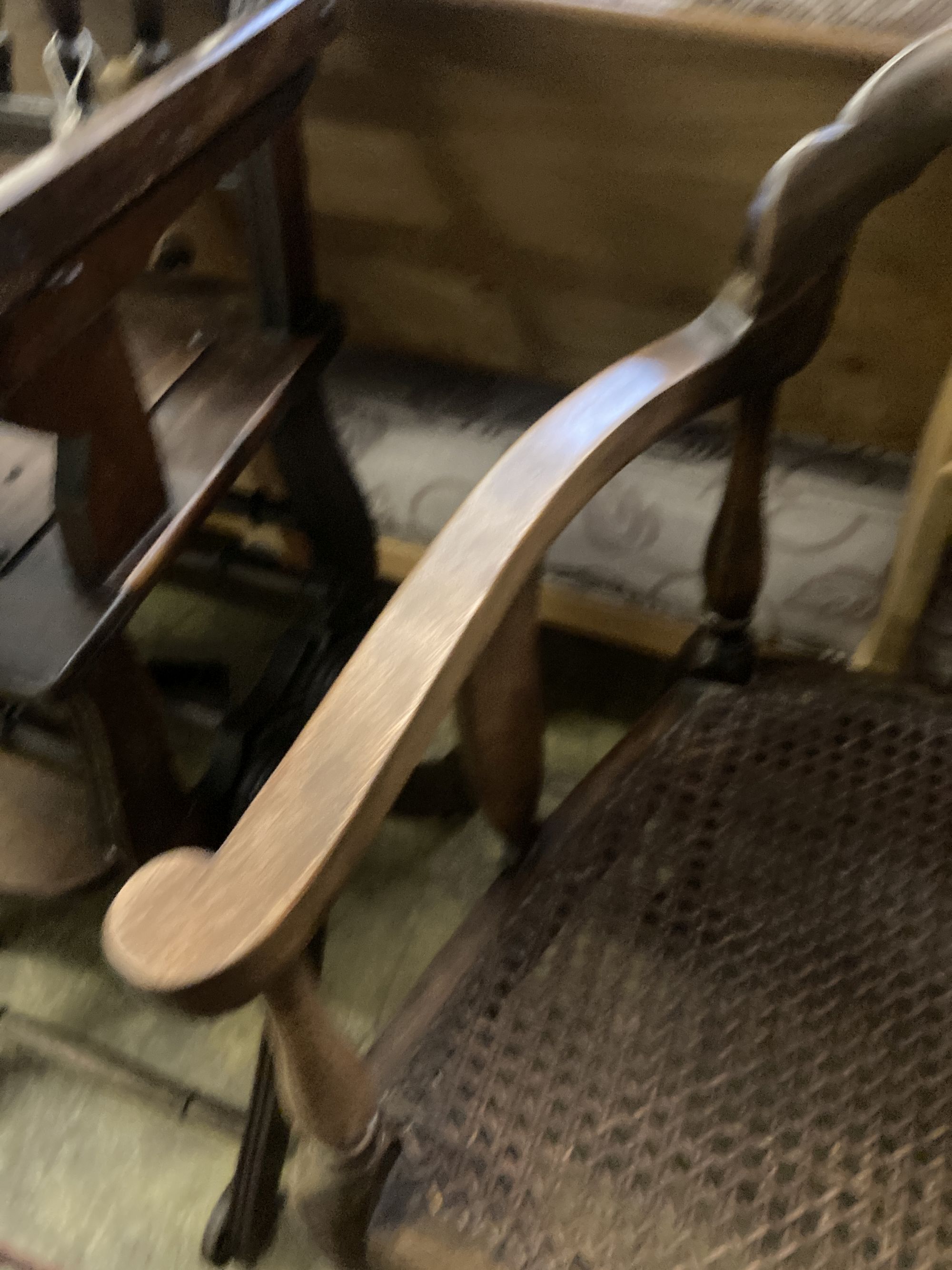 A 1920s circular caned beech occasional table, diameter 76cm, together with a pair of elbow chairs, one with a later tapestry seat